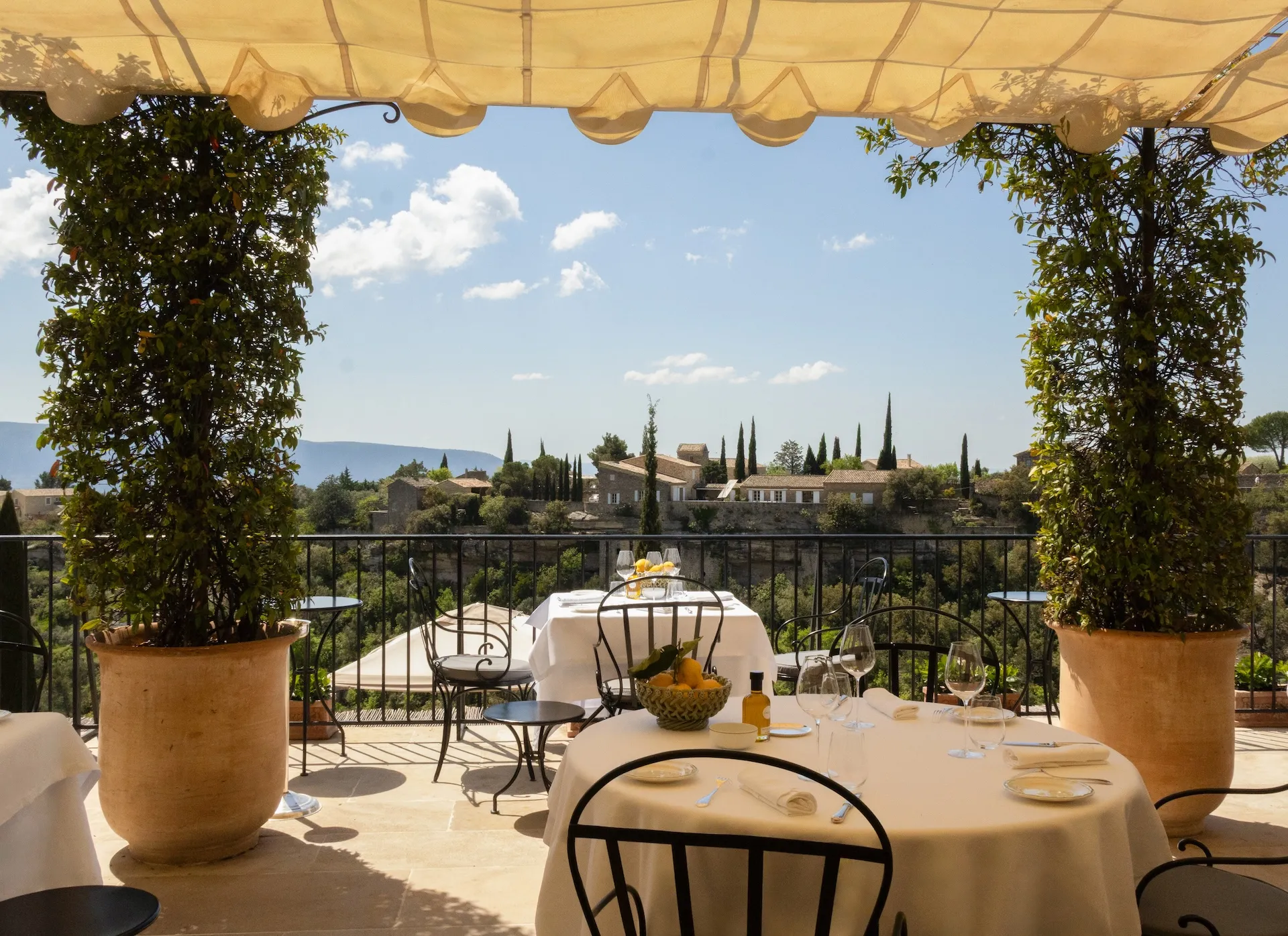 A terraced garden pool at Airelles Gordes with the Luberon valley in the distance