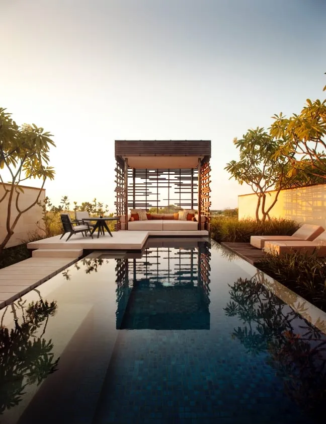 A private pool villa at Alila Villas Uluwatu with limestone walls and timber pavilion roof