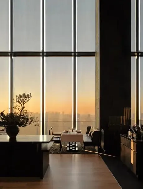 The 30-metre indoor pool at Aman Spa, lined in black granite with panoramic views over central Tokyo