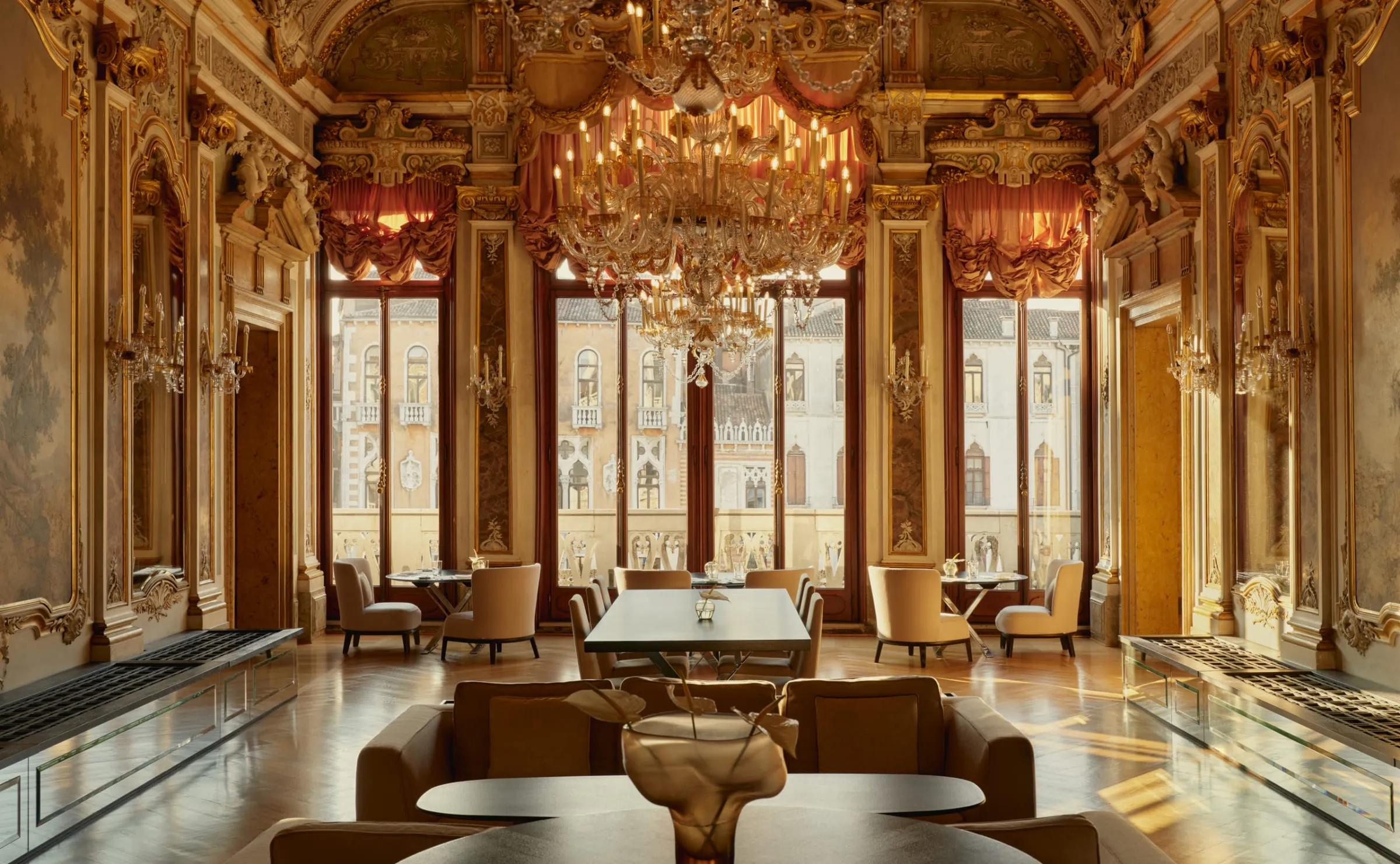 A frescoed reception room at Aman Venice with 18th-century Tiepolo ceiling paintings