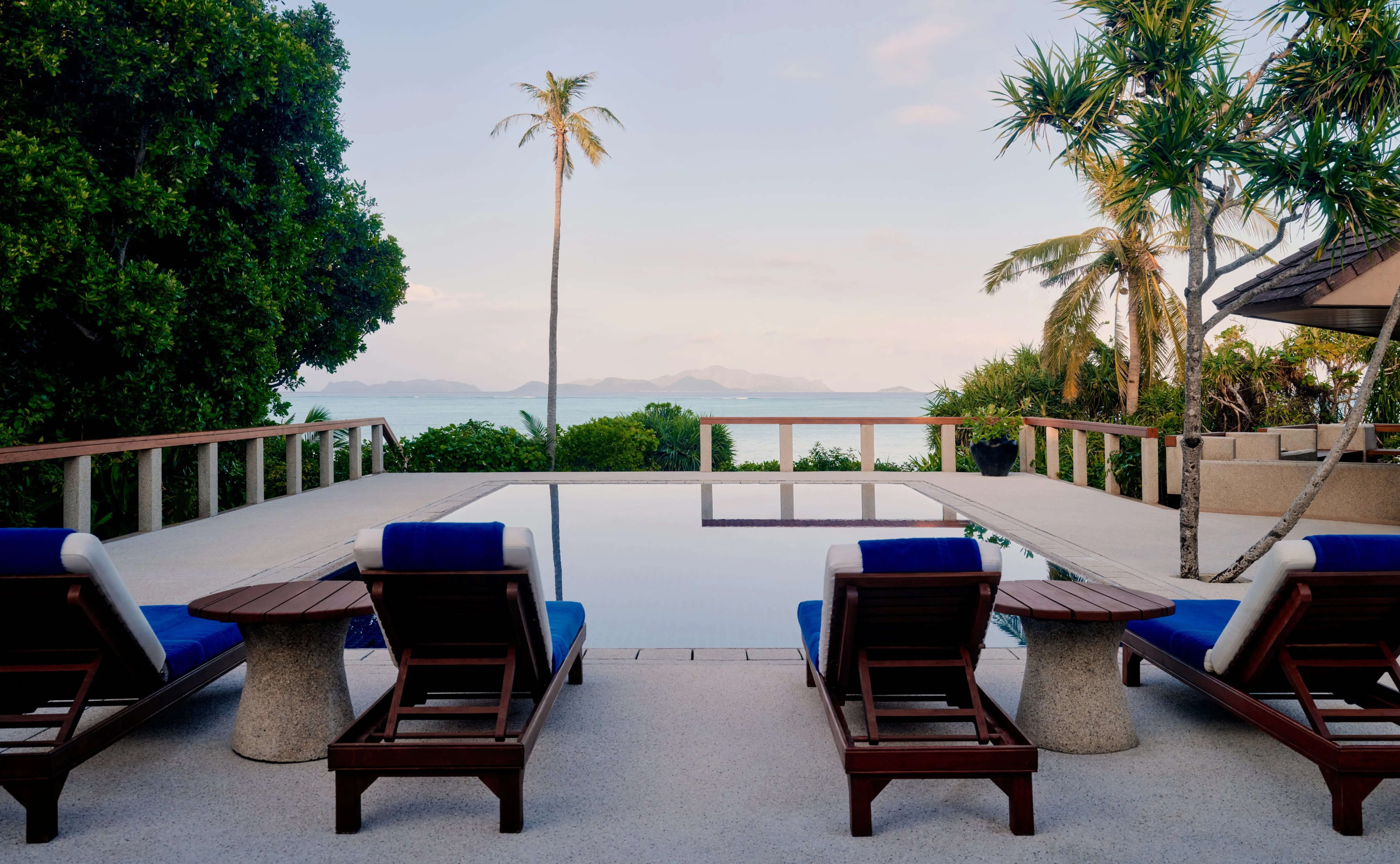A private plunge pool on a casita deck overlooking the treetop canopy at Amanpulo