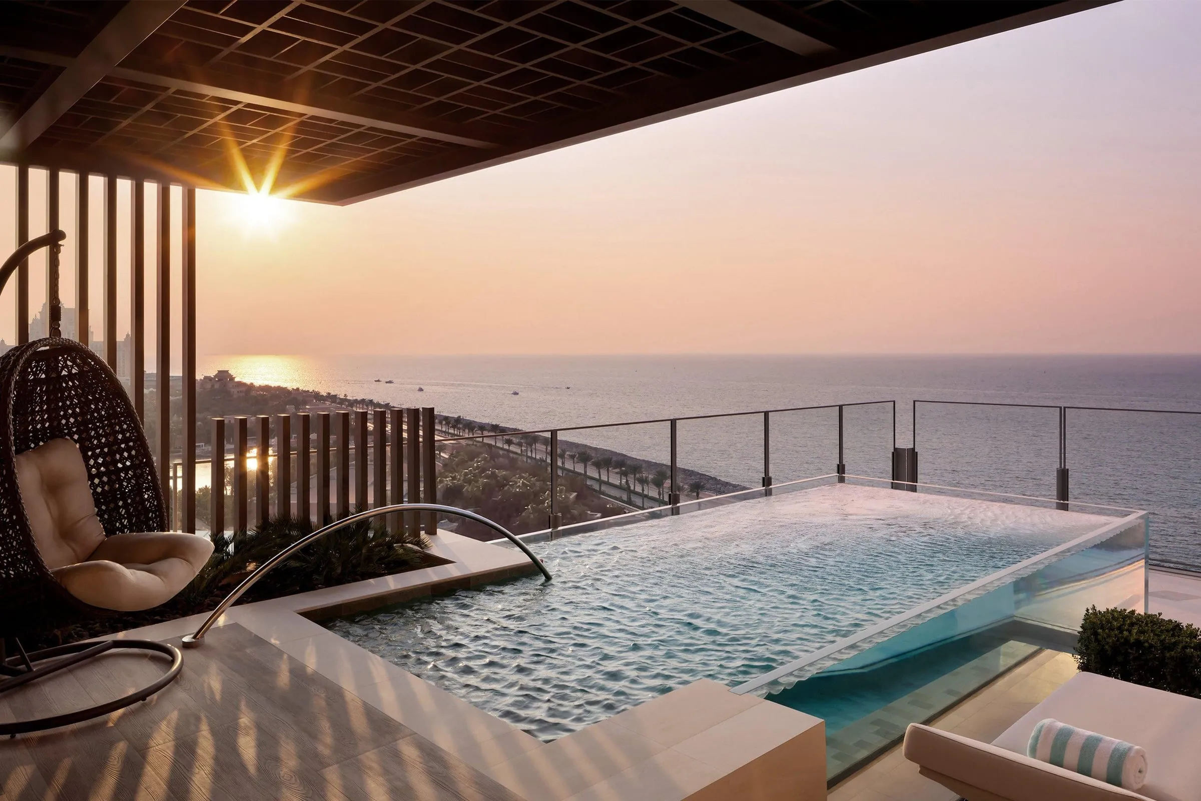 A guest suite interior at Atlantis The Royal with a floor-to-ceiling view of the Arabian Gulf