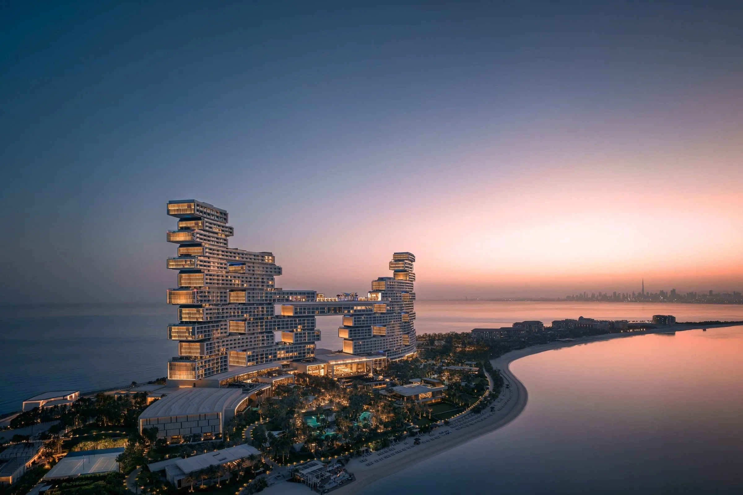 Atlantis The Royal's stacked towers on Palm Jumeirah, connected by a sky bridge with an elevated pool