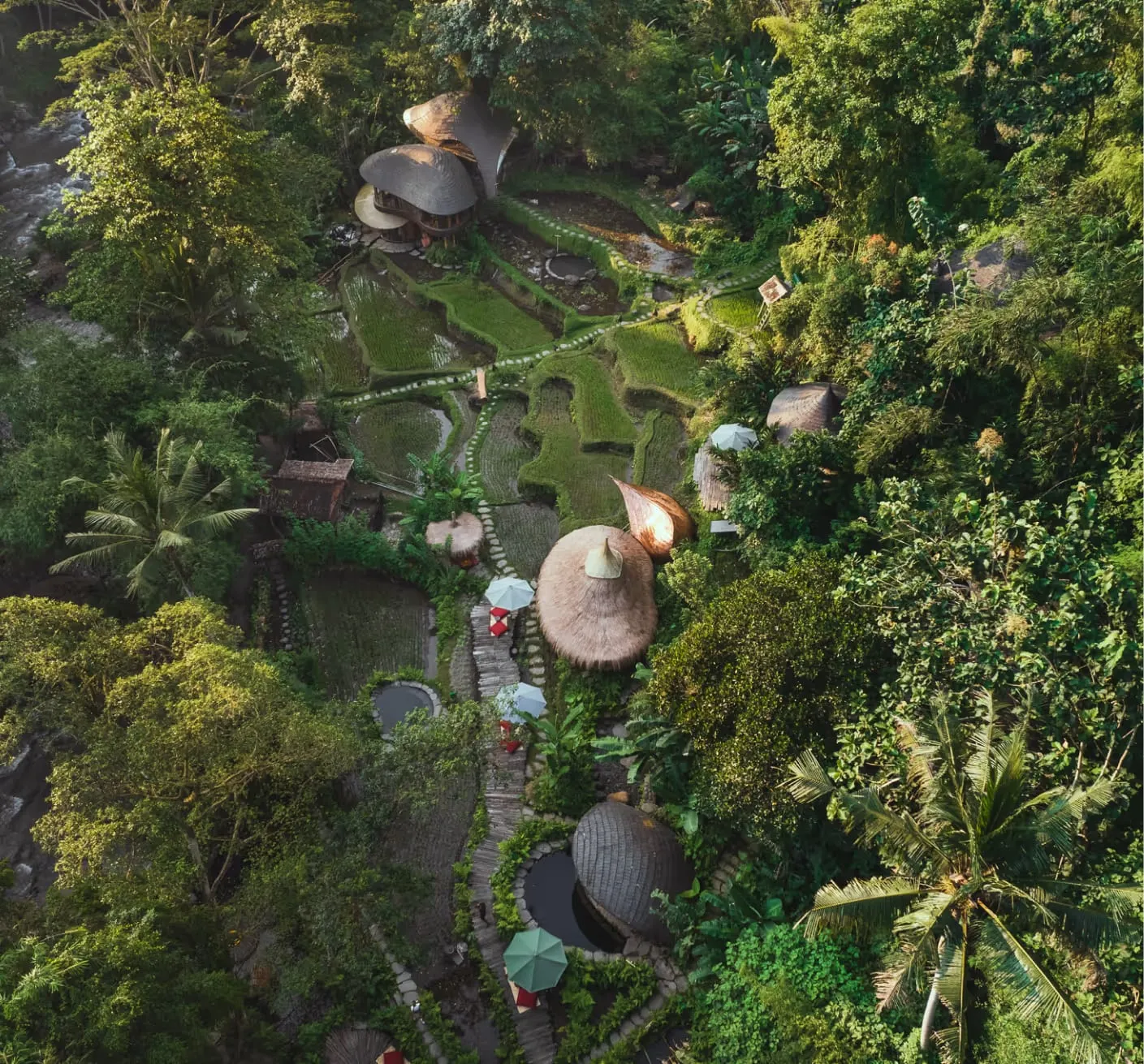 An antique Javanese teak house on stilts overlooking the jungle ridge and Ayung River gorge at Bambu Indah, Ubud