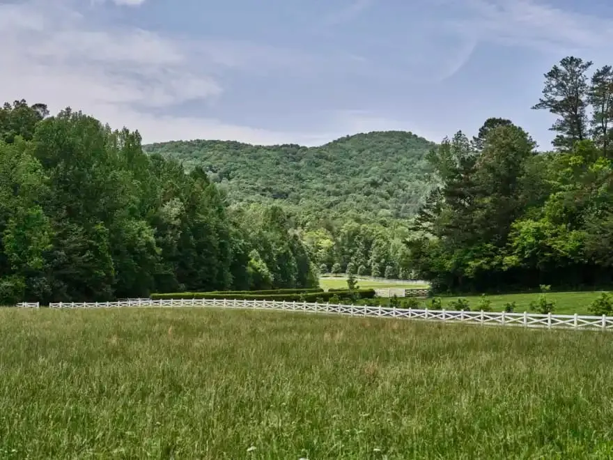 The Wellhouse spa building at Blackberry Farm surrounded by wooded hillside