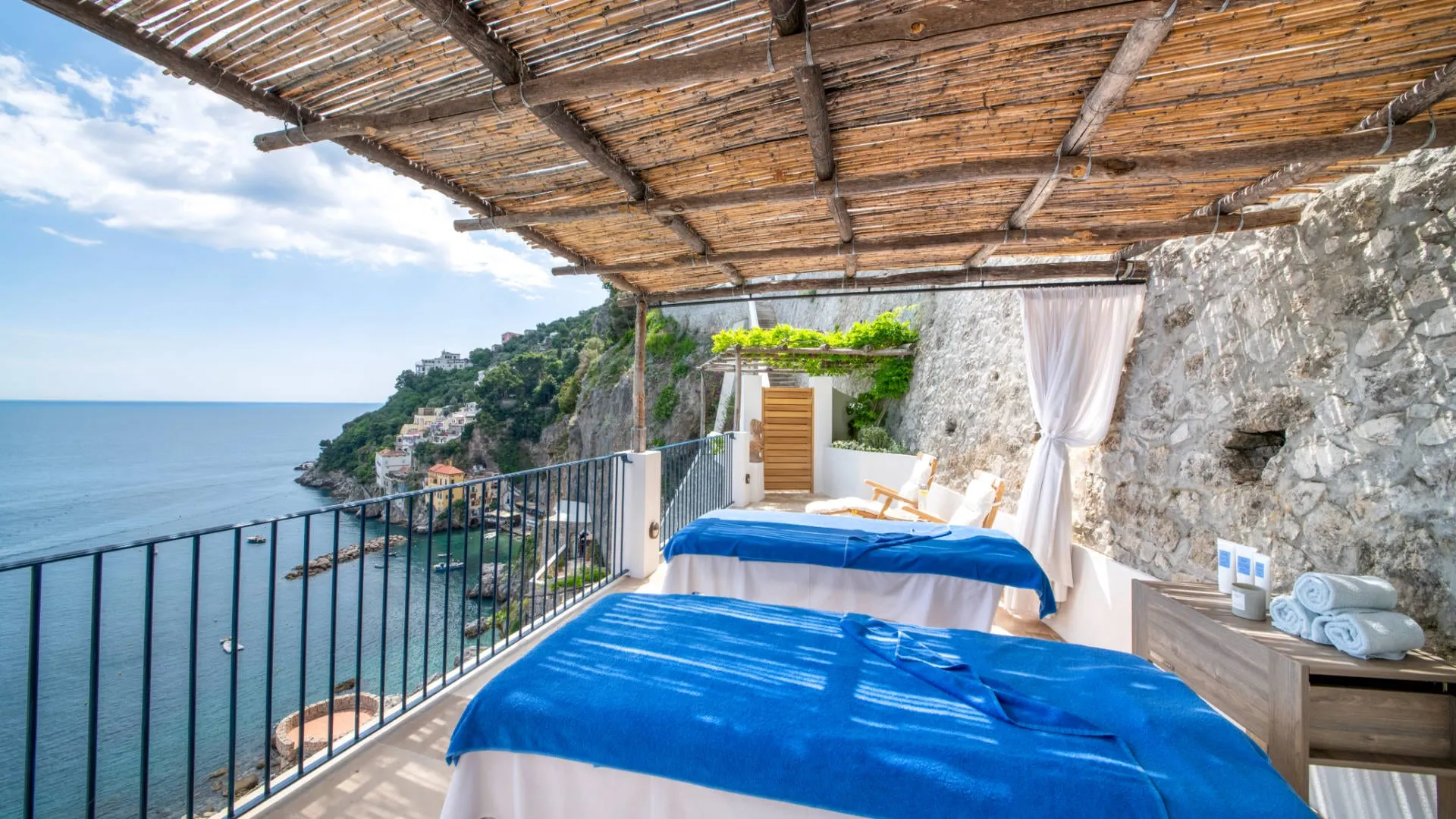 The private beach and jetty of the Marinella Beach Club below Borgo Santandrea