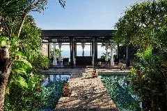 Volcanic stone and alang-alang thatched architecture at Bulgari Resort Bali
