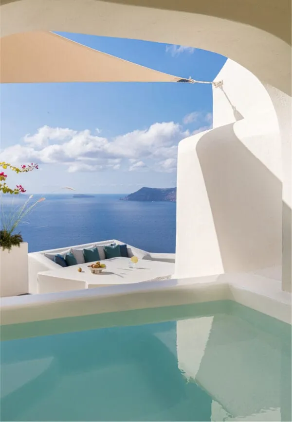 Cube-shaped cave suites of Canaves Oia Suites stepped into the caldera cliff face in Oia, Santorini