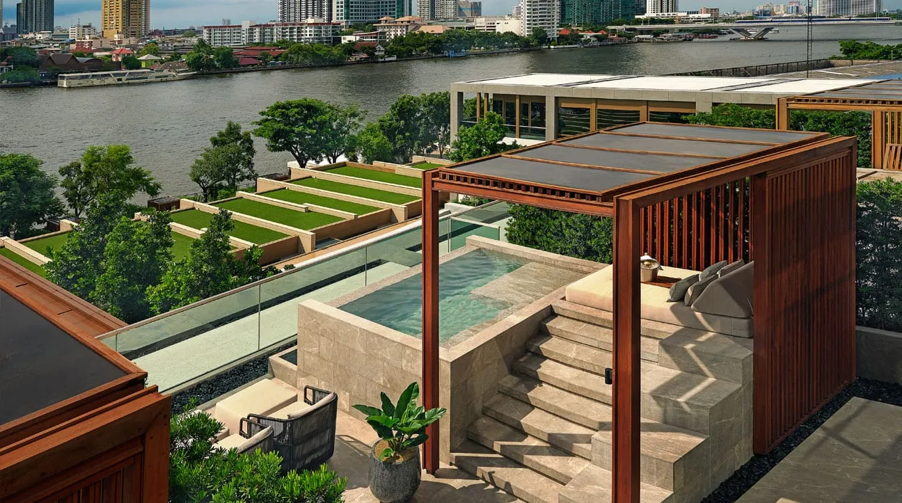 A treatment room at Auriga Wellness, the spa at Capella Bangkok, with natural materials and soft lighting