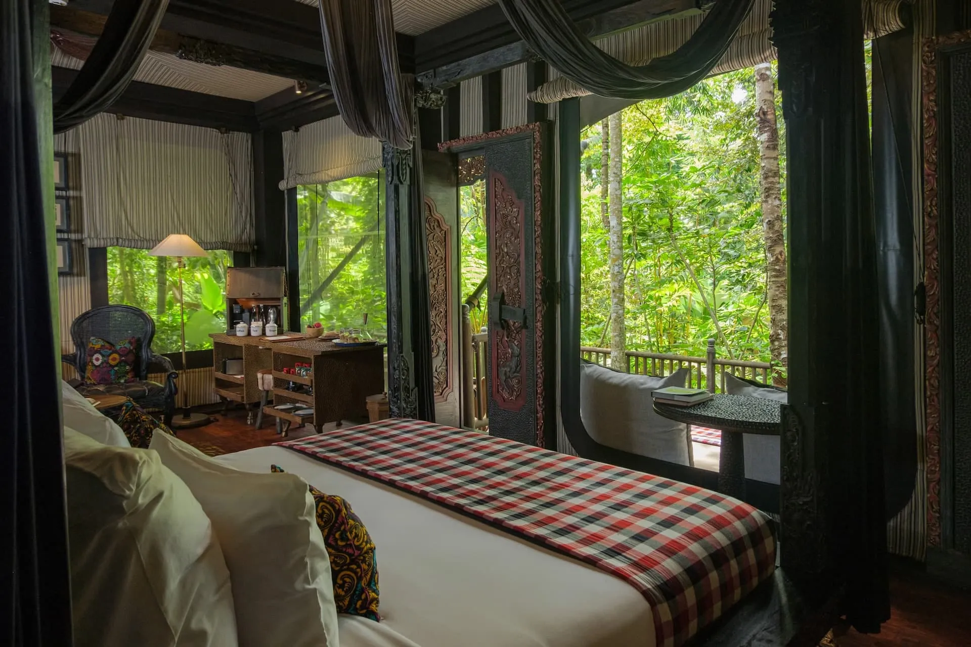 Interior of a tent at Capella Ubud with a copper bathtub and colonial-explorer-inspired furnishings