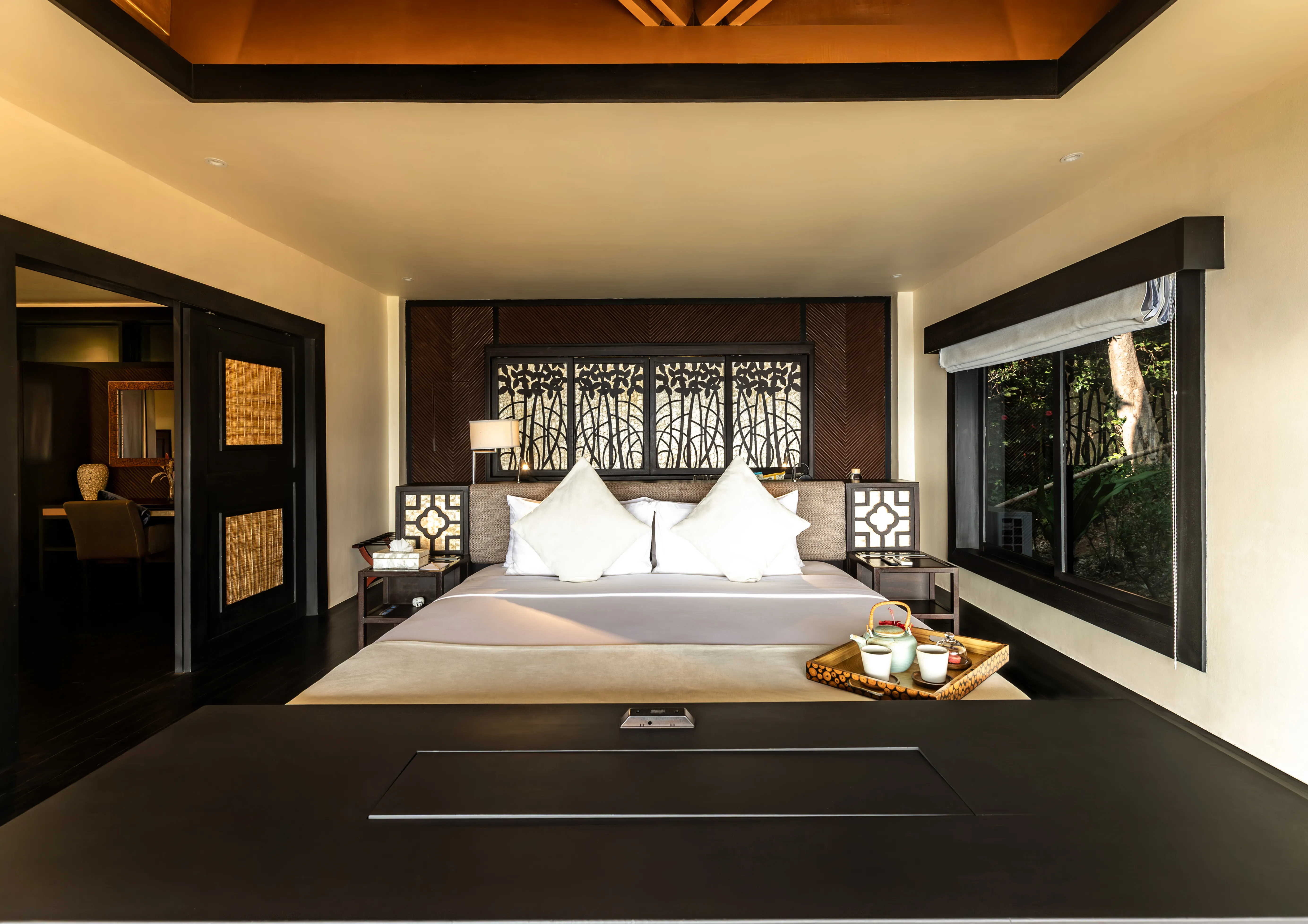 A water villa at Cauayan Island Resort raised on stilts above the shallows of Bacuit Bay