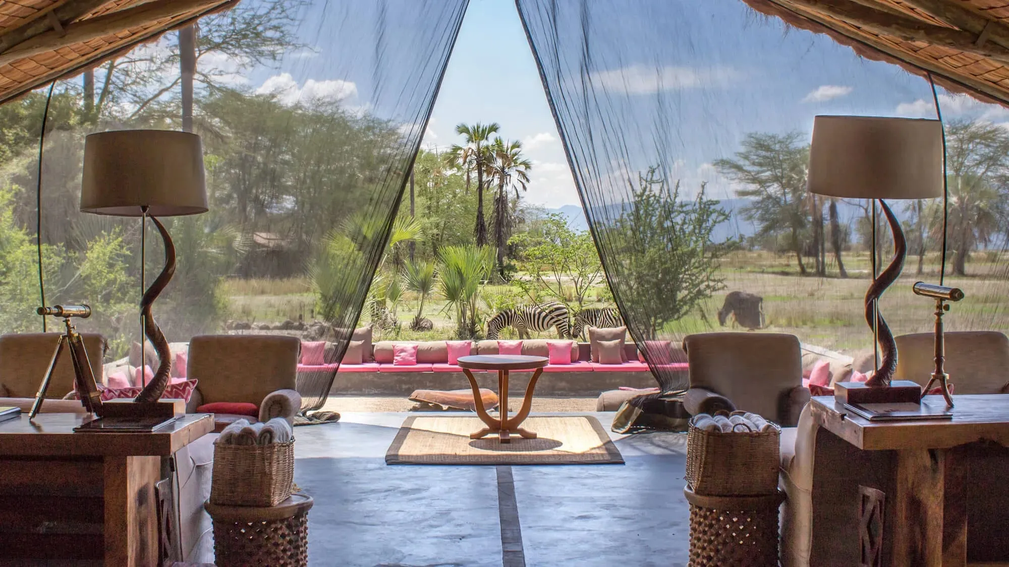 The open-sided dining and lounge area of the main lodge at Chem Chem, built in a flamingo-wing configuration overlooking Lake Manyara