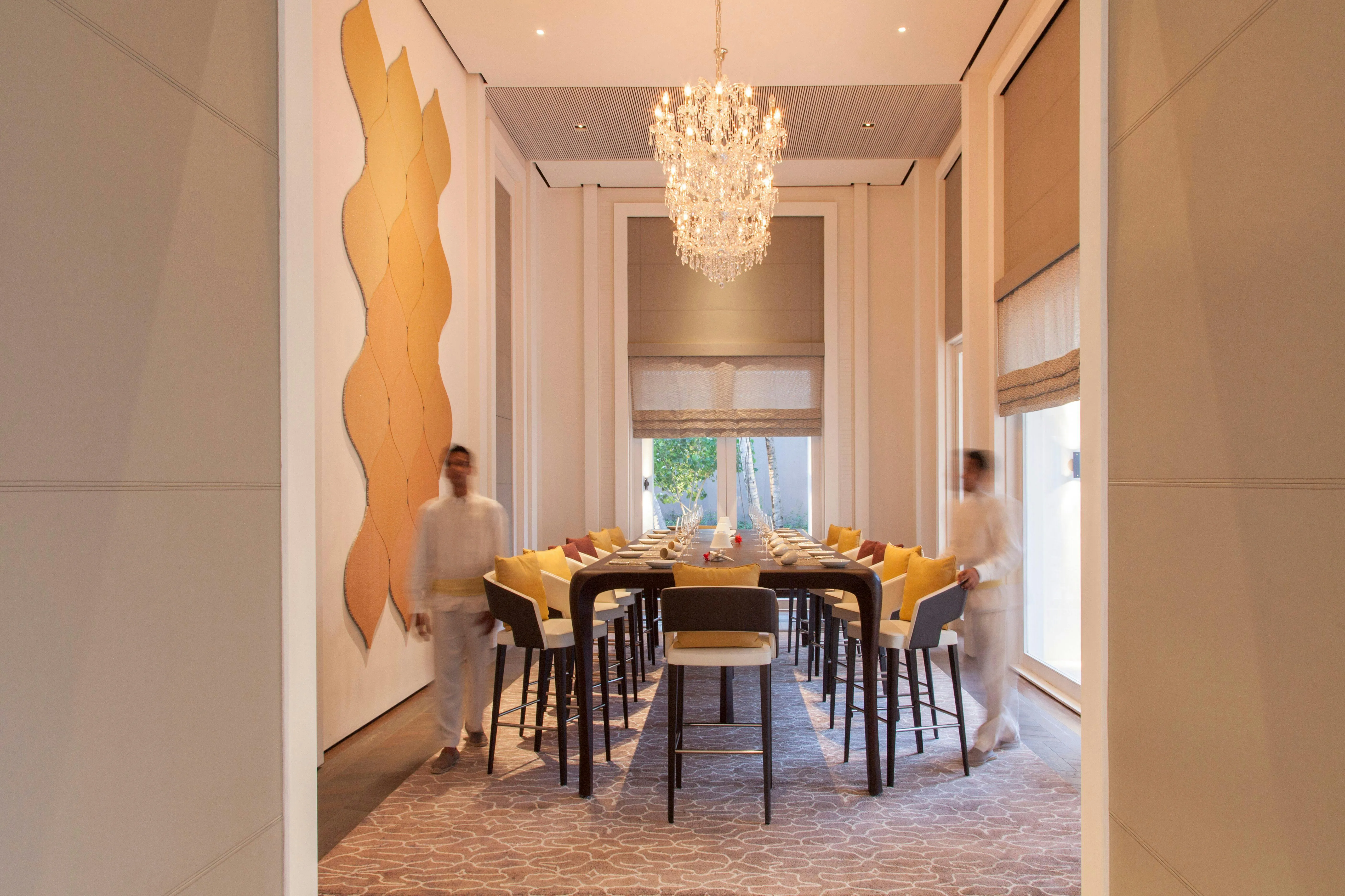 The interior of a villa living space at Cheval Blanc Randheli showing rattan, bamboo and mother-of-pearl detailing