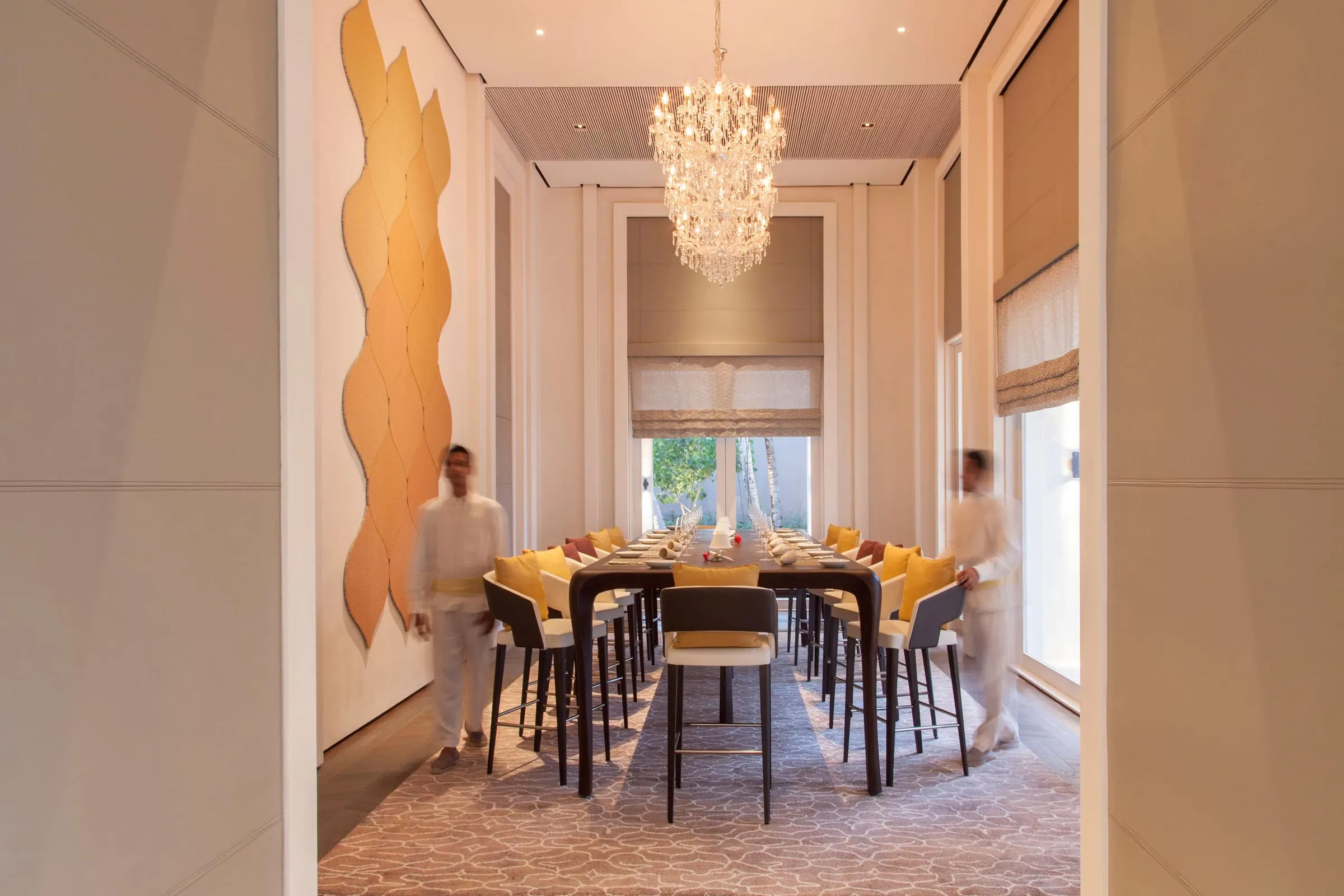 The interior of a villa living space at Cheval Blanc Randheli showing rattan, bamboo and mother-of-pearl detailing