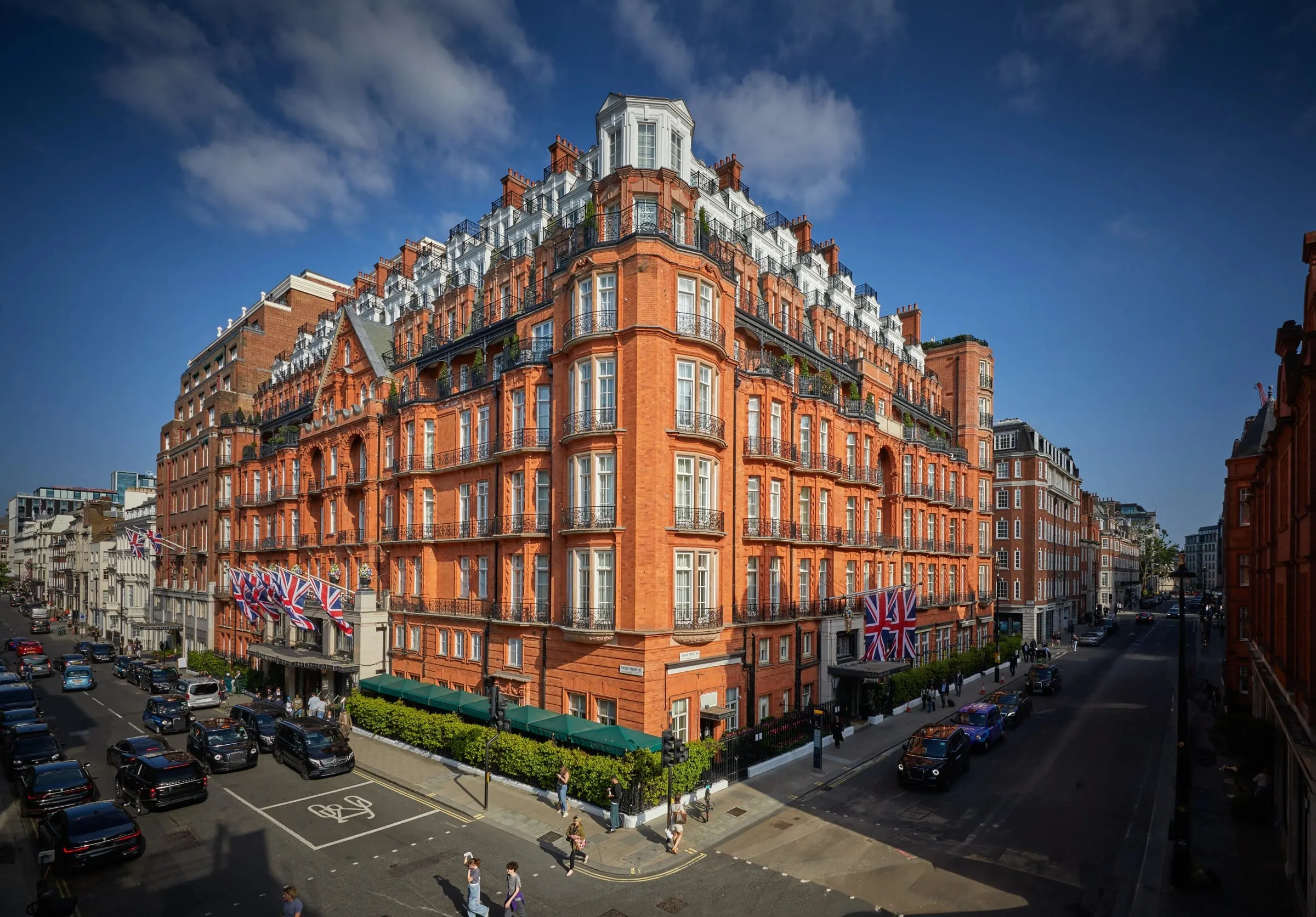 The Art Deco facade of Claridge's on the corner of Brook Street and Davies Street in Mayfair, London, at dusk