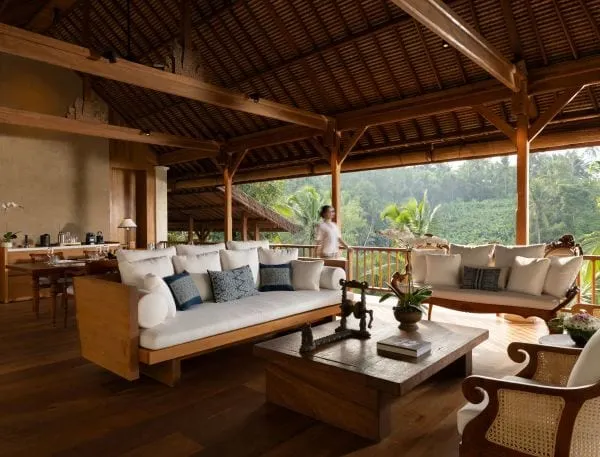 A COMO Shambhala Suite interior with Indonesian antiques and a private jacuzzi overlooking the jungle