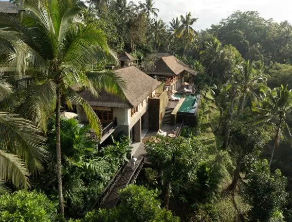 Riverine jungle canopy and stone-and-thatch pavilions at COMO Shambhala Estate above the Ayung River, Ubud, Bali