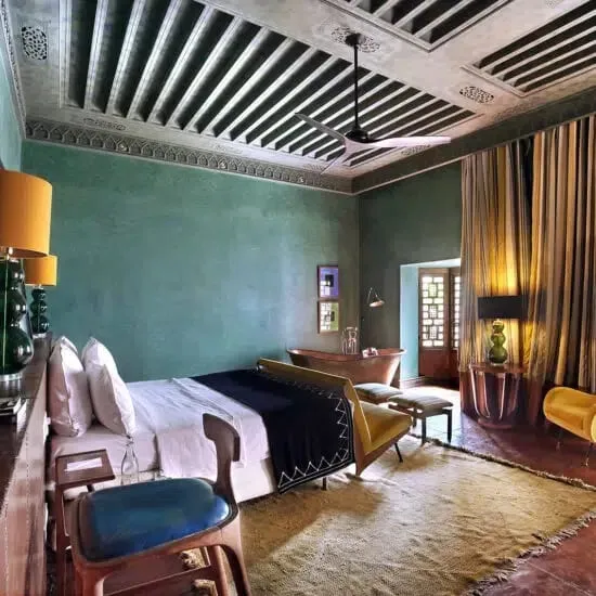 Contemporary African art displayed against traditional tadelakt walls at El Fenn