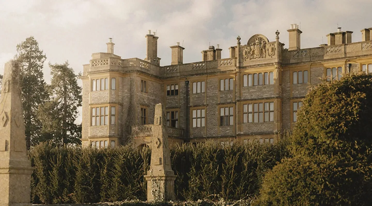 The Jacobethan stone facade of Estelle Manor, formerly Eynsham Hall, set against Oxfordshire parkland