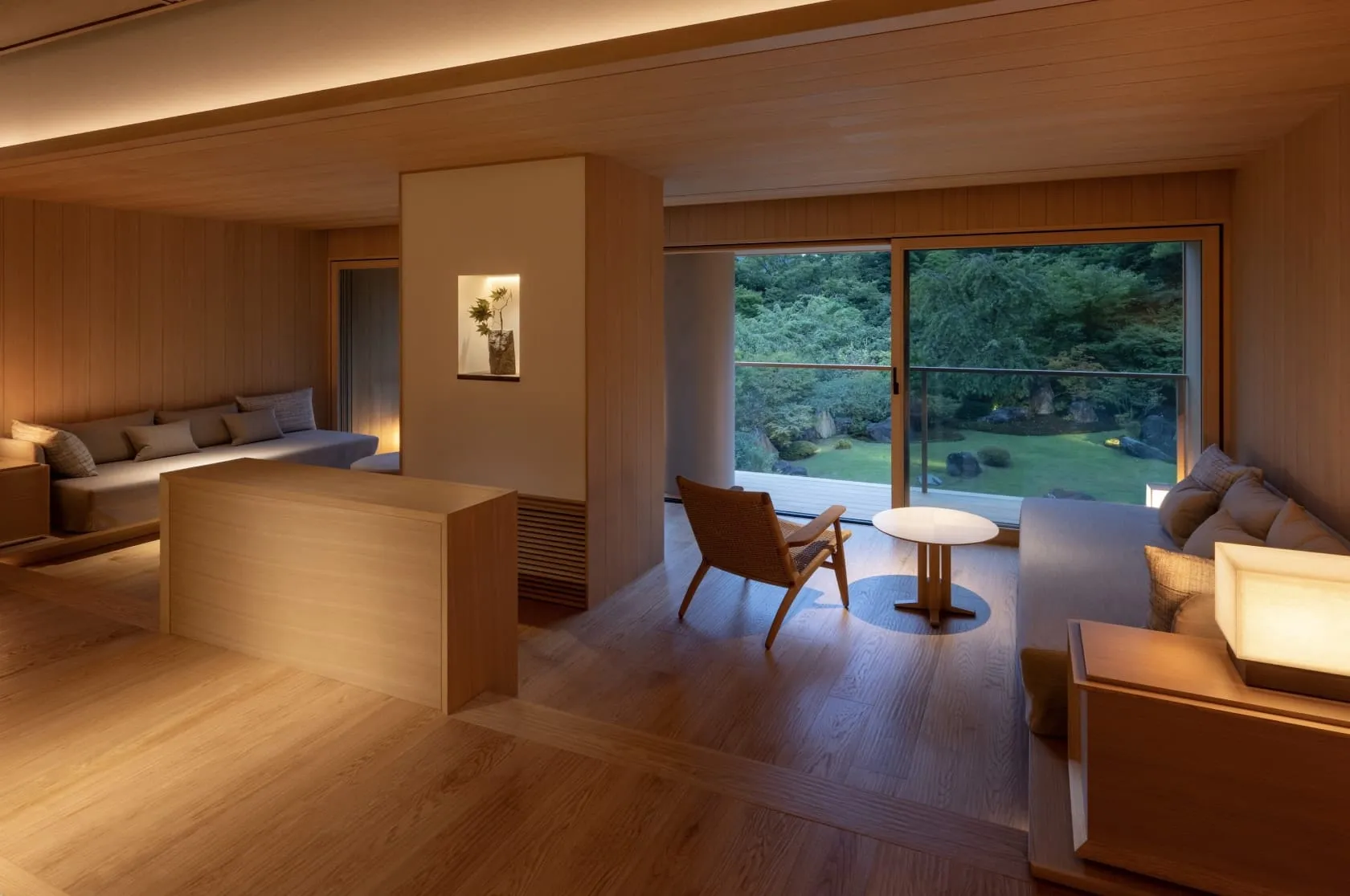 A Gora Kadan guest room with tatami flooring, low table and a private open-air onsen bath fed by the Gora hot spring