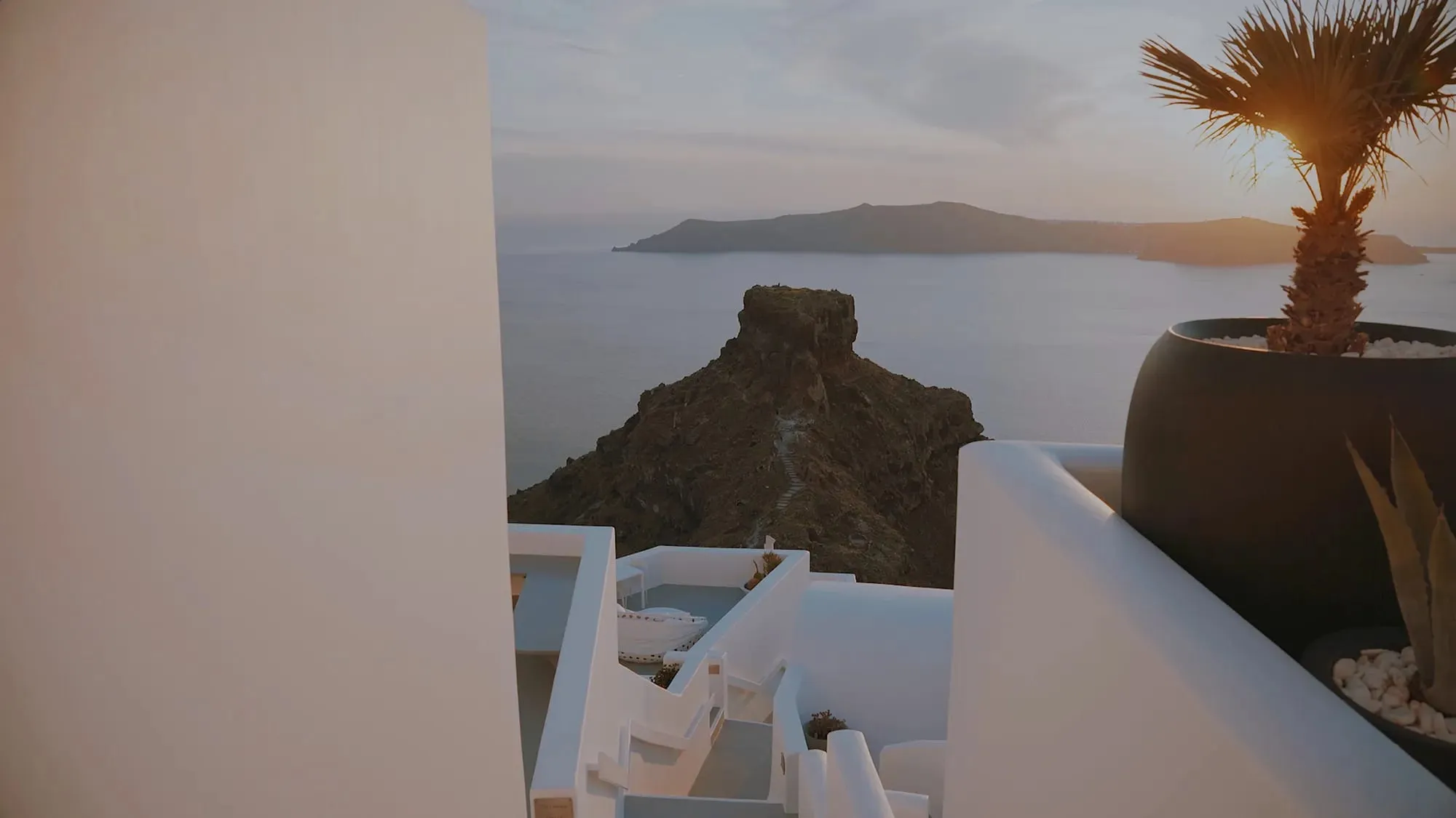 Grace Hotel Santorini's whitewashed cliffside terraces above the caldera in Imerovigli