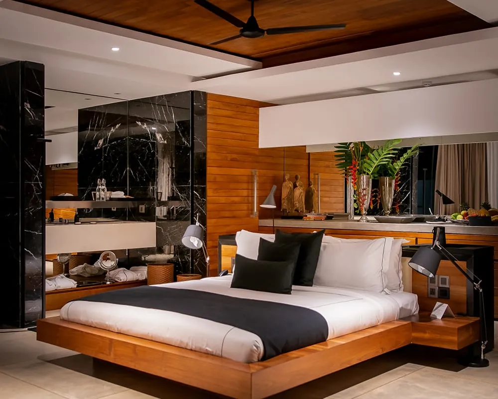 Private saltwater plunge pool on the terrace of a one-bedroom villa, screened by forest planting