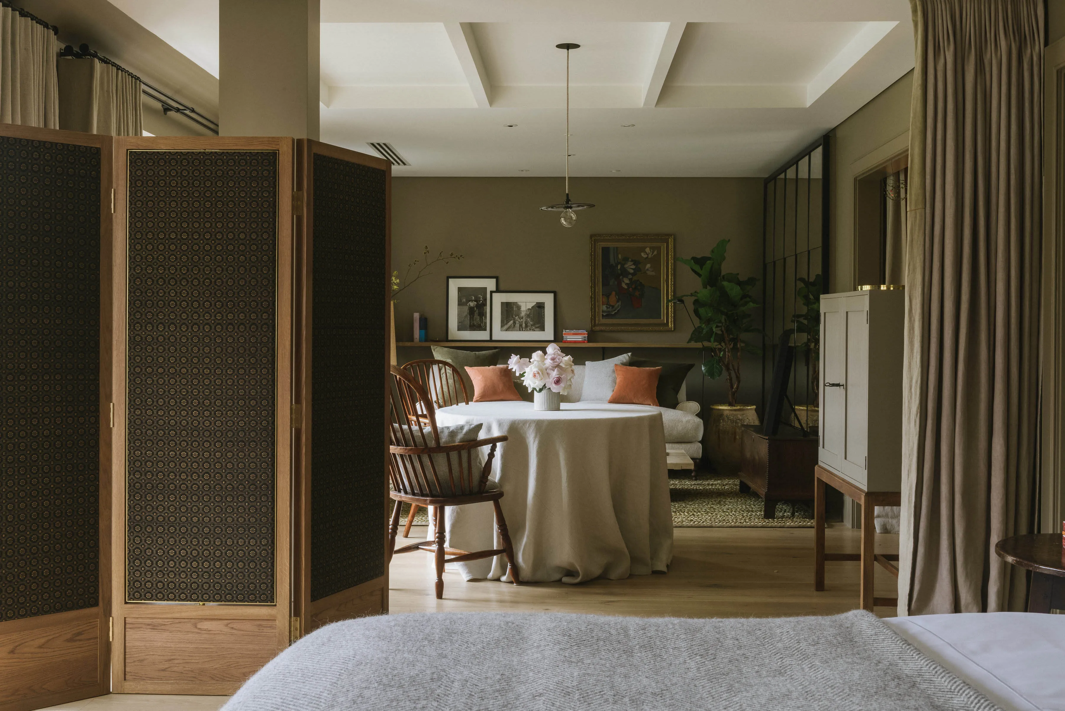 A Signature Room at Heckfield Place with muted tones and garden views