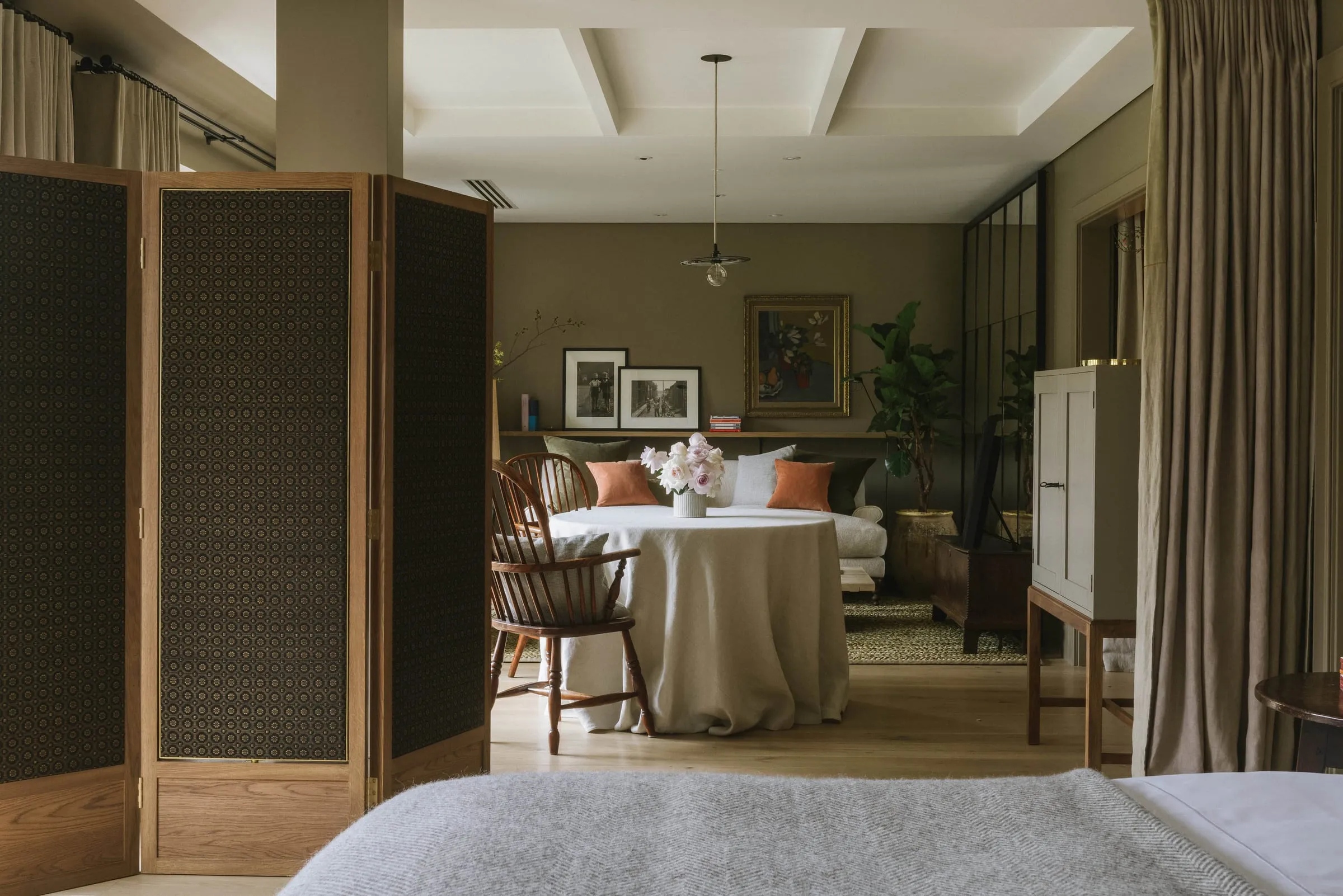 A Signature Room at Heckfield Place with muted tones and garden views
