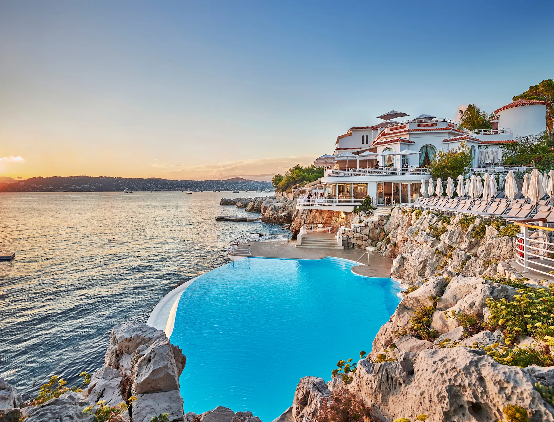 The Eden-Roc pavilion's saltwater pool at Hotel du Cap-Eden-Roc, cut into the clifftop rock above the Mediterranean on Cap d'Antibes