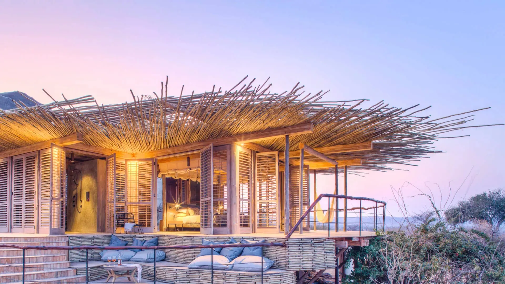 A suite at Jabali Ridge built into a kopje of giant granite boulders overlooking Ruaha National Park's baobab-studded plains