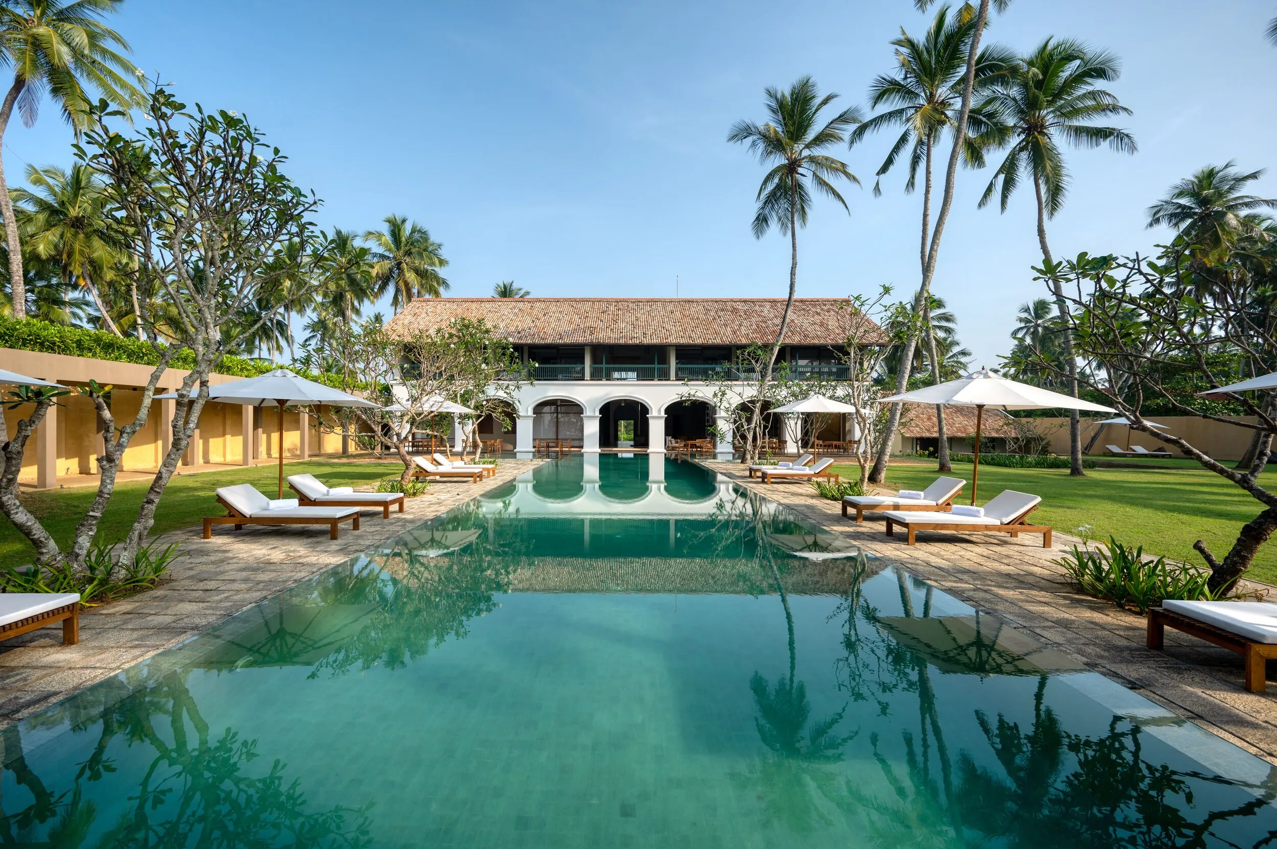 Low-slung earth-toned pavilions of Kayaam House set between jungle and a deserted stretch of beach near Rekawa, Sri Lanka