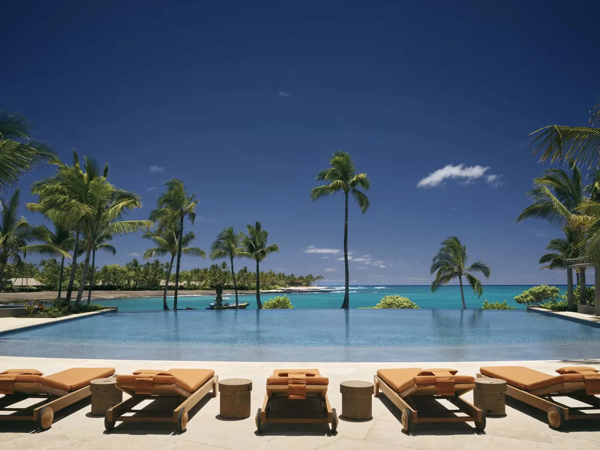 An outdoor treatment space at Asaya spa surrounded by tropical planting