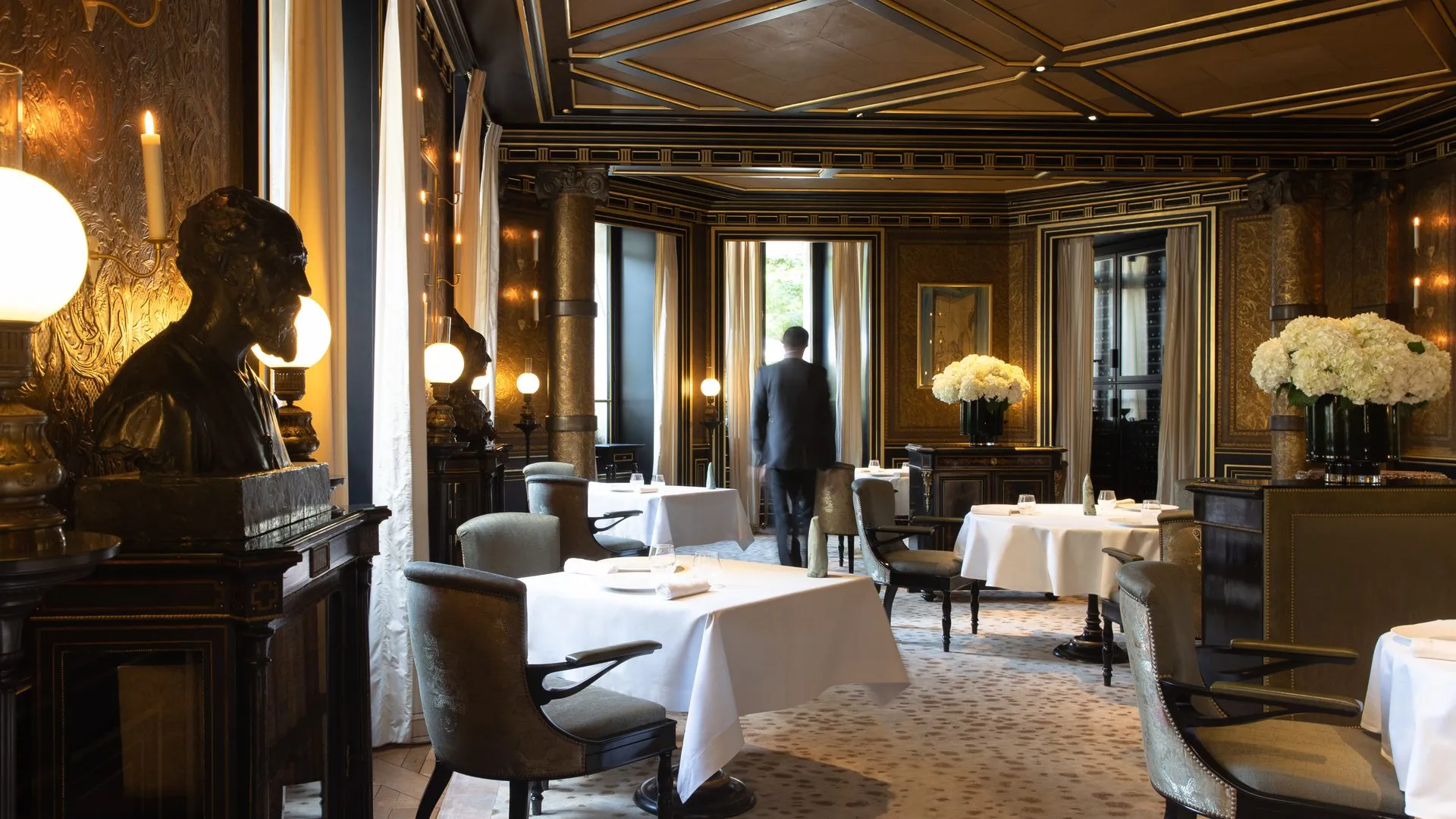 A table set in the dining room of Le Gabriel, the three-Michelin-starred restaurant inside La Reserve Paris