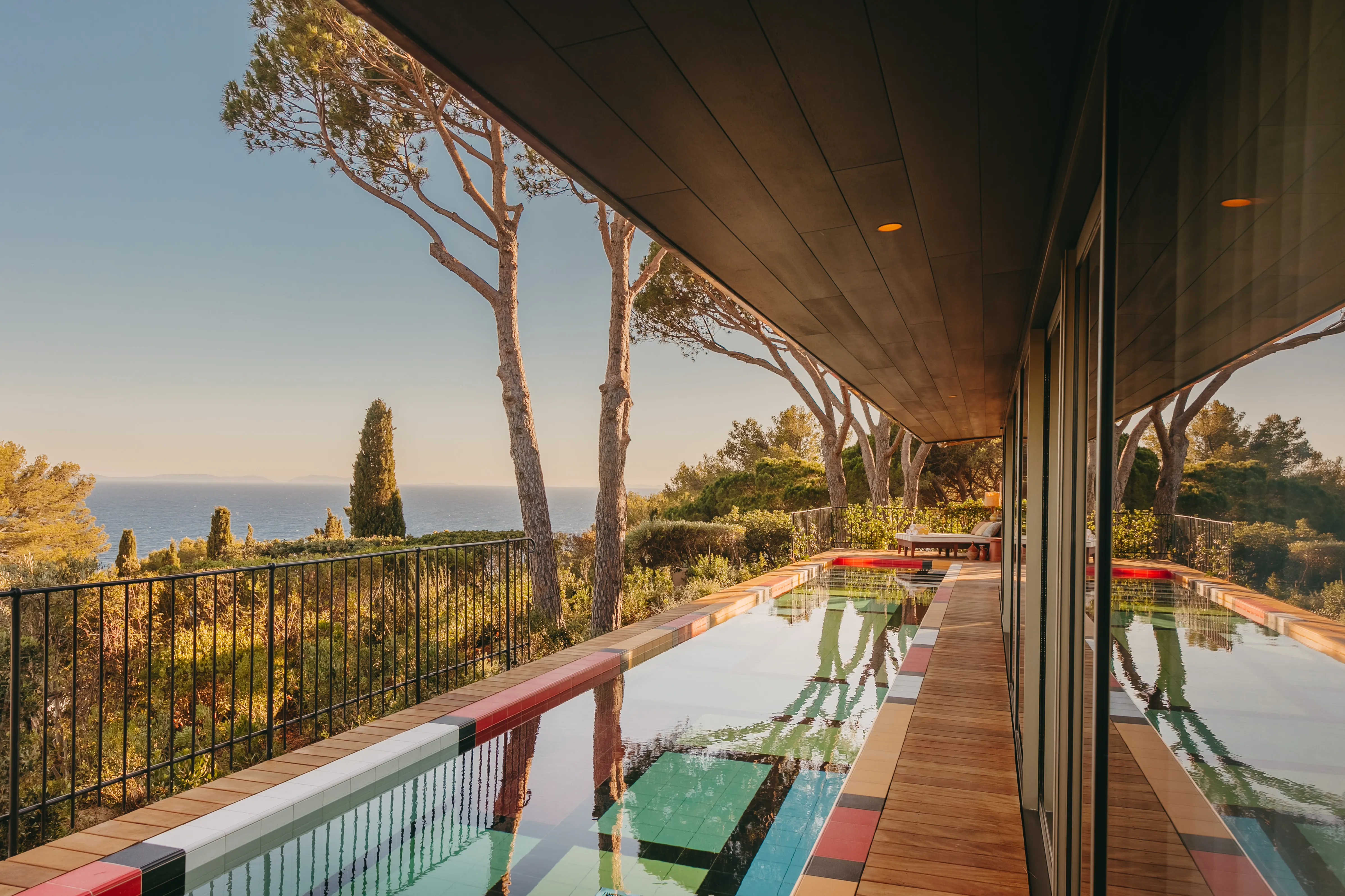 Low-rise, vegetated-roof pavilions of Lily of the Valley set into a pine-covered hillside above the Mediterranean, near Saint-Tropez