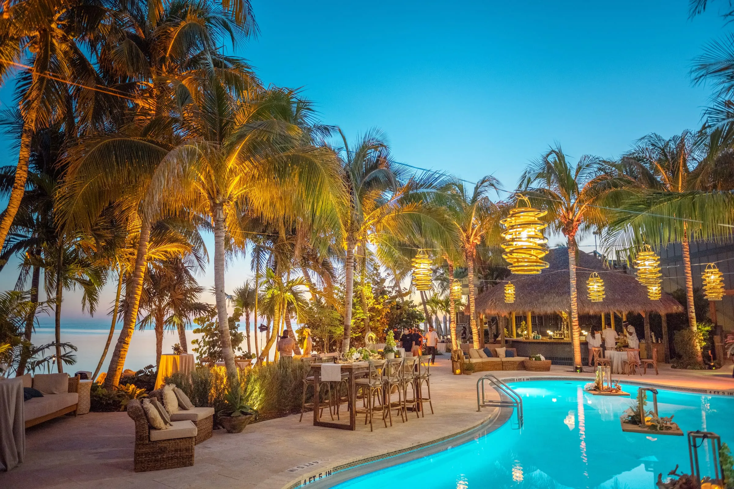 Two-story open-air atrium of SpaTerre spa with a reflecting pool at Little Palm Island