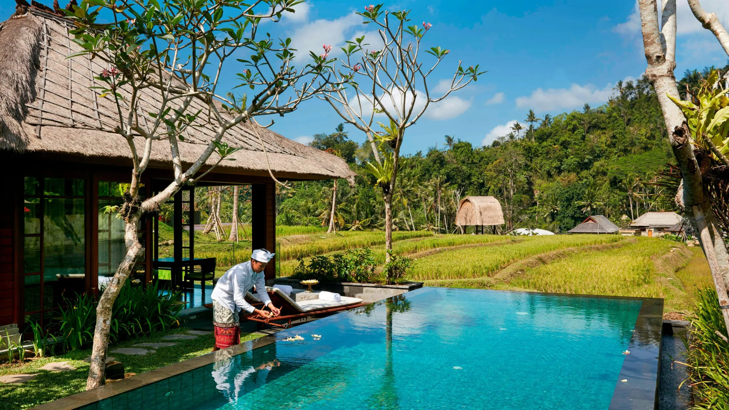 One of Mandapa's 25 private pool villas with an open-air living pavilion overlooking the jungle valley