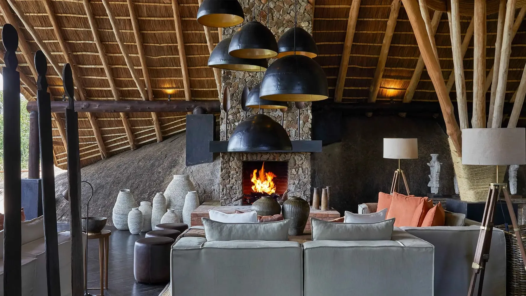 A tented suite interior at Mwiba Lodge with a private deck overlooking the Arugusinyai River gorge