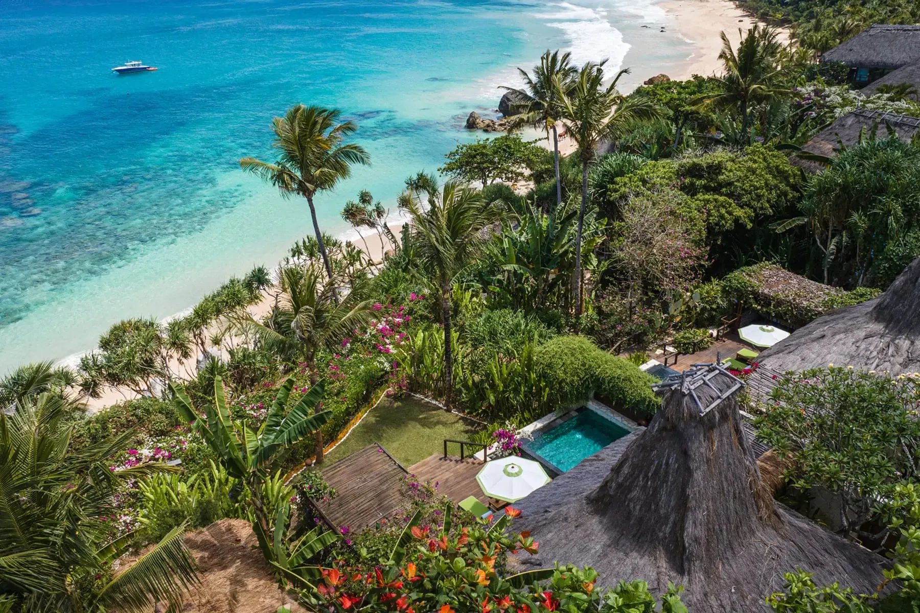 A private villa pool at NIHI Sumba overlooking the wild coastline and surf break of Nihiwatu Beach on Sumba's west coast