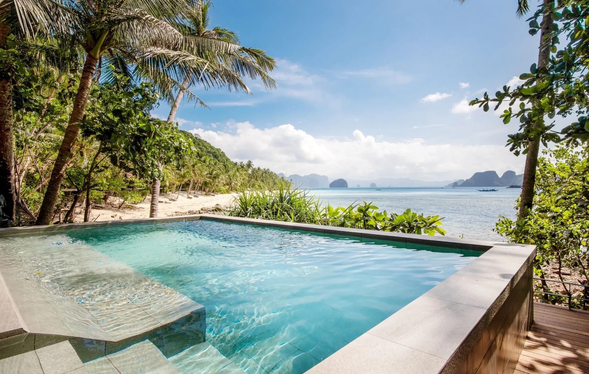 The view from Pangulasian Island's hilltop viewing deck across the limestone karst islands of Bacuit Bay at sunset