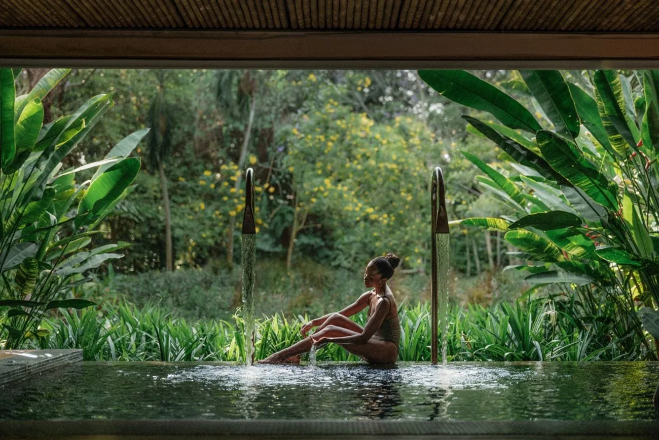 The Spa at Phulay Bay's Thai pavilion structure surrounded by gardens and still water