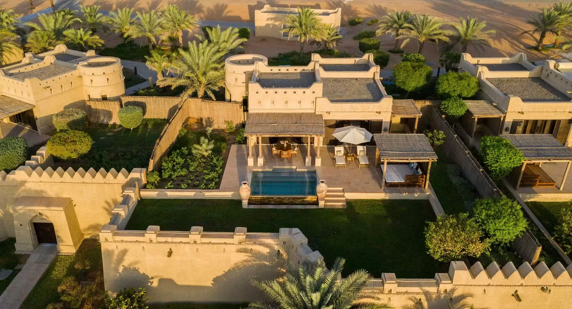 A crenellated tower and courtyard at Qasr Al Sarab, built to resemble a historic Arabian fortress