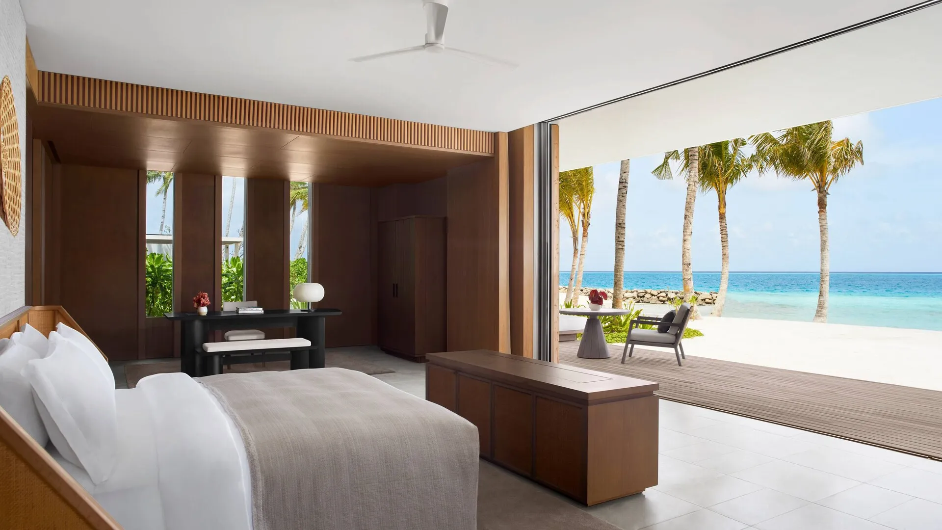 Round overwater villas with private infinity pools arranged around the lagoon at The Ritz-Carlton Maldives, Fari Islands