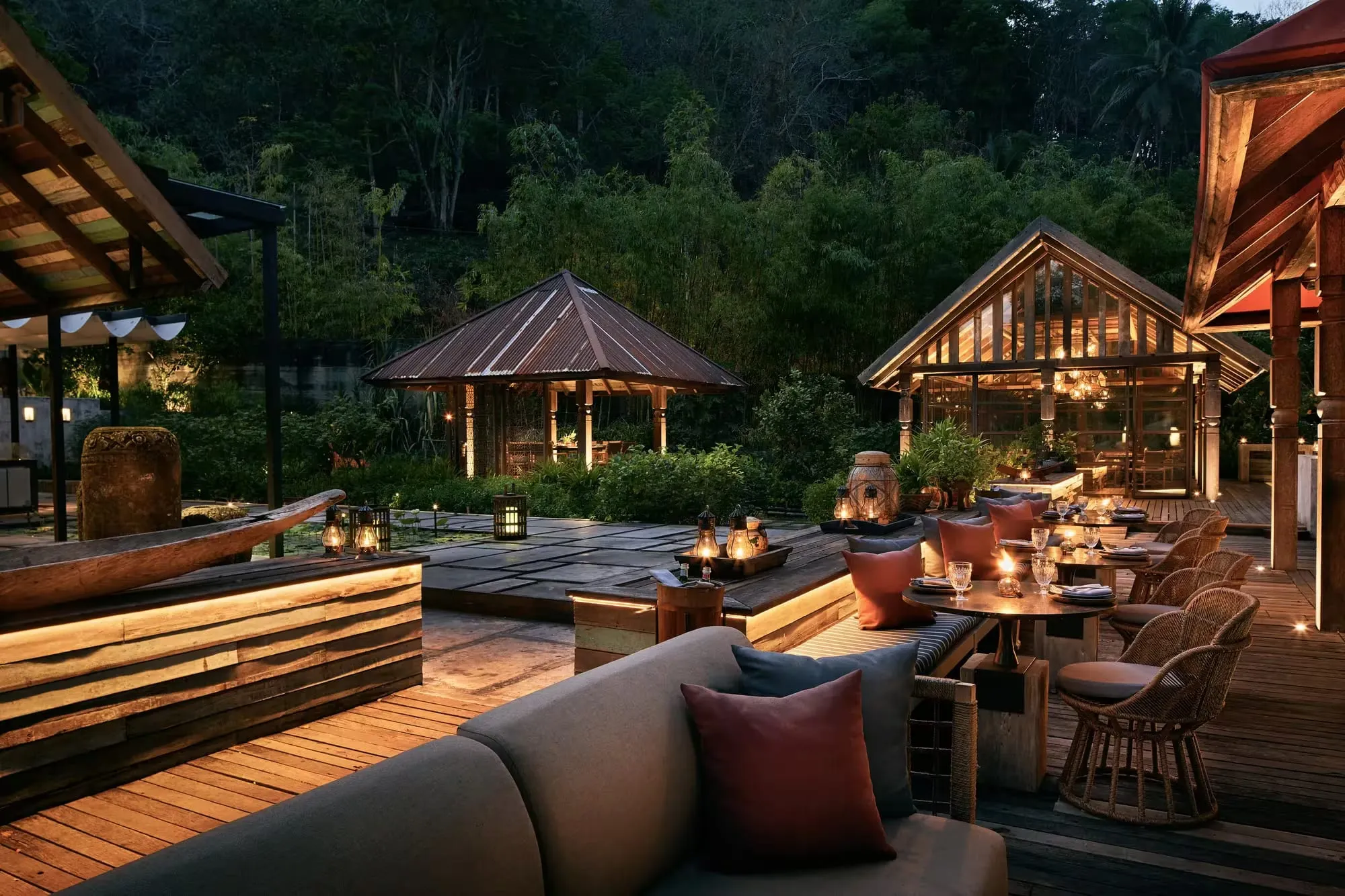 Ta Khai restaurant terrace at Rosewood Phuket set among trees with views toward the Andaman Sea