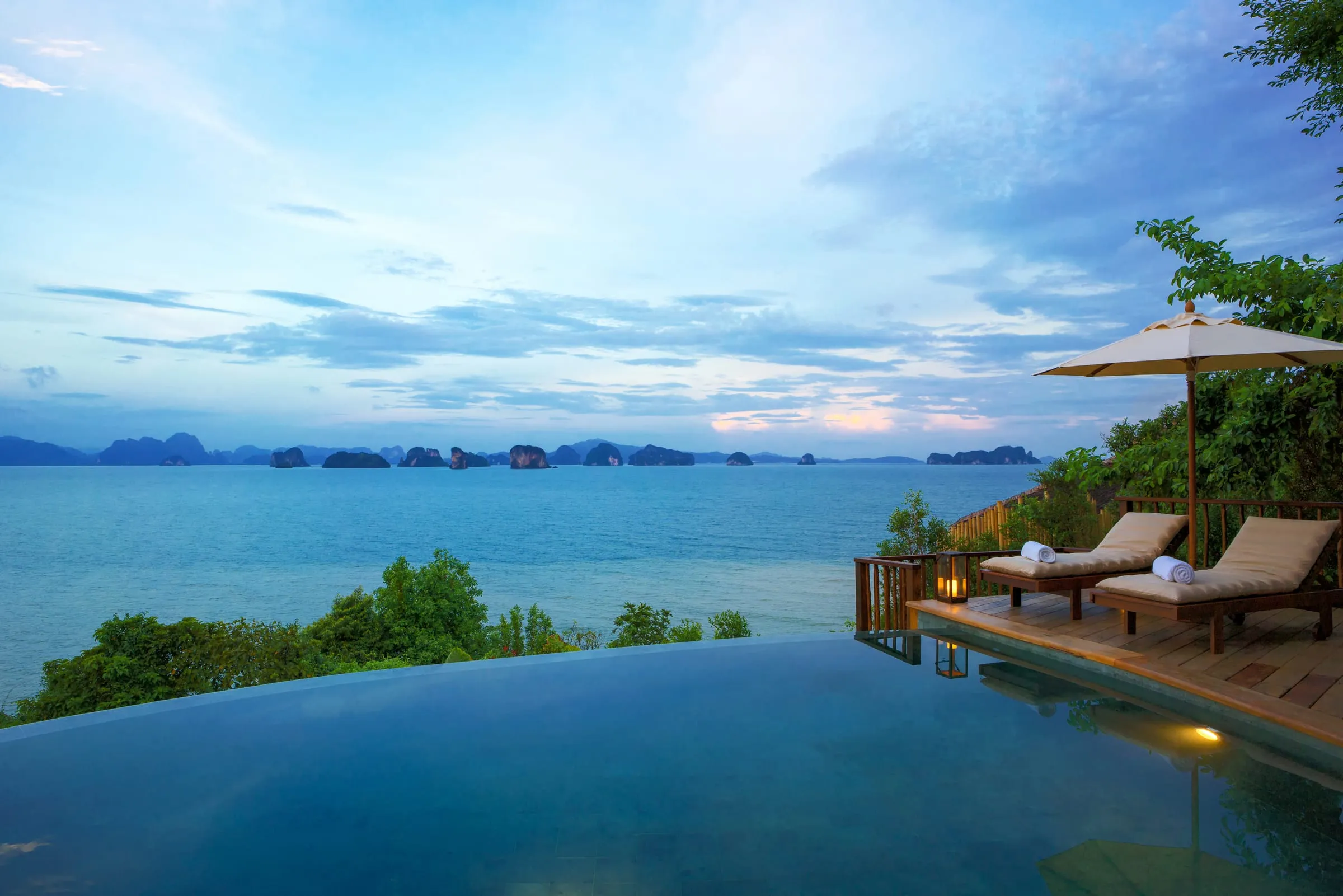 Private infinity pool on a villa deck overlooking limestone karsts in Phang Nga Bay