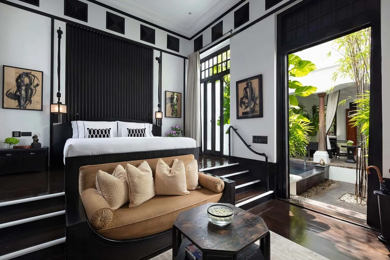 A riverside pool villa terrace at The Siam overlooking the Chao Phraya River