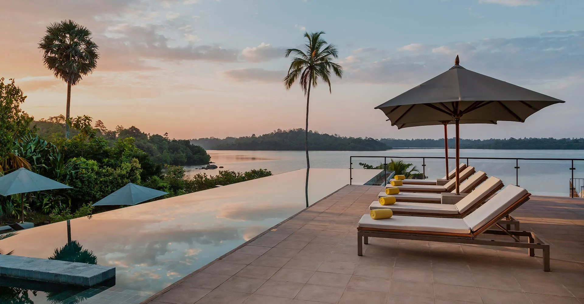 The infinity pool at Tri hotel facing the open water of Koggala Lake