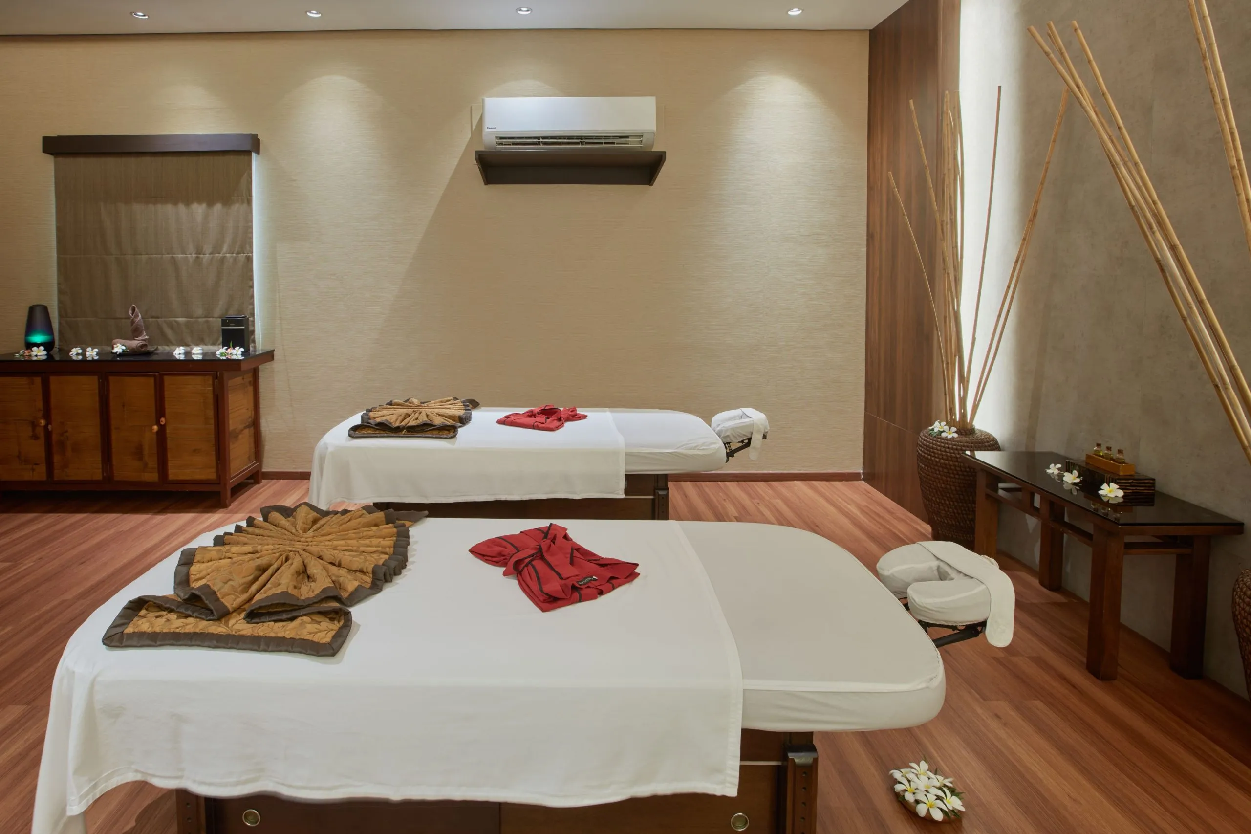 A treatment room at Narra Spa with soft lighting and prepared massage beds at Two Seasons Coron