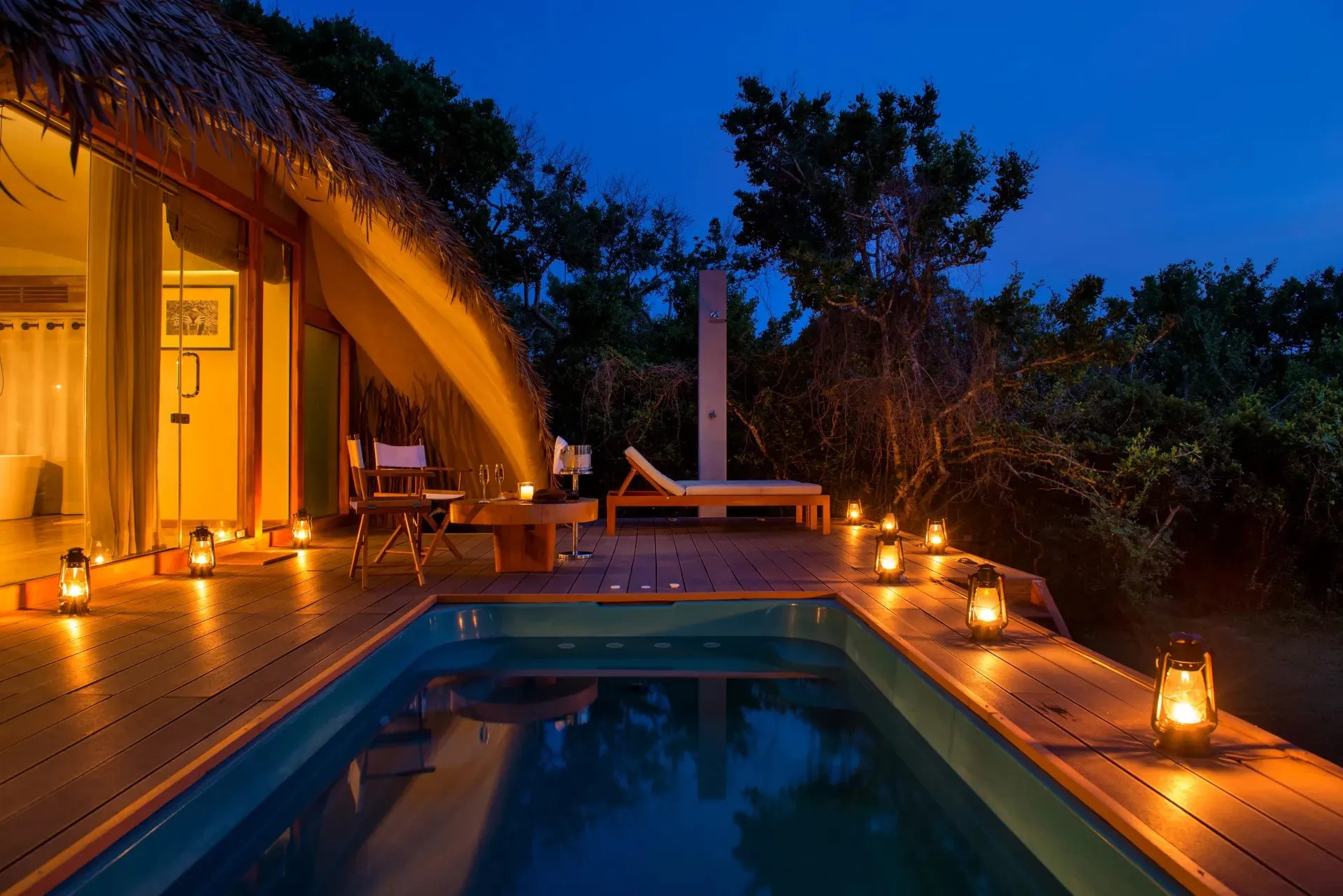 A thatched cabin at Uga Chena Huts with a private plunge pool set among dry-zone scrub at the edge of Yala National Park