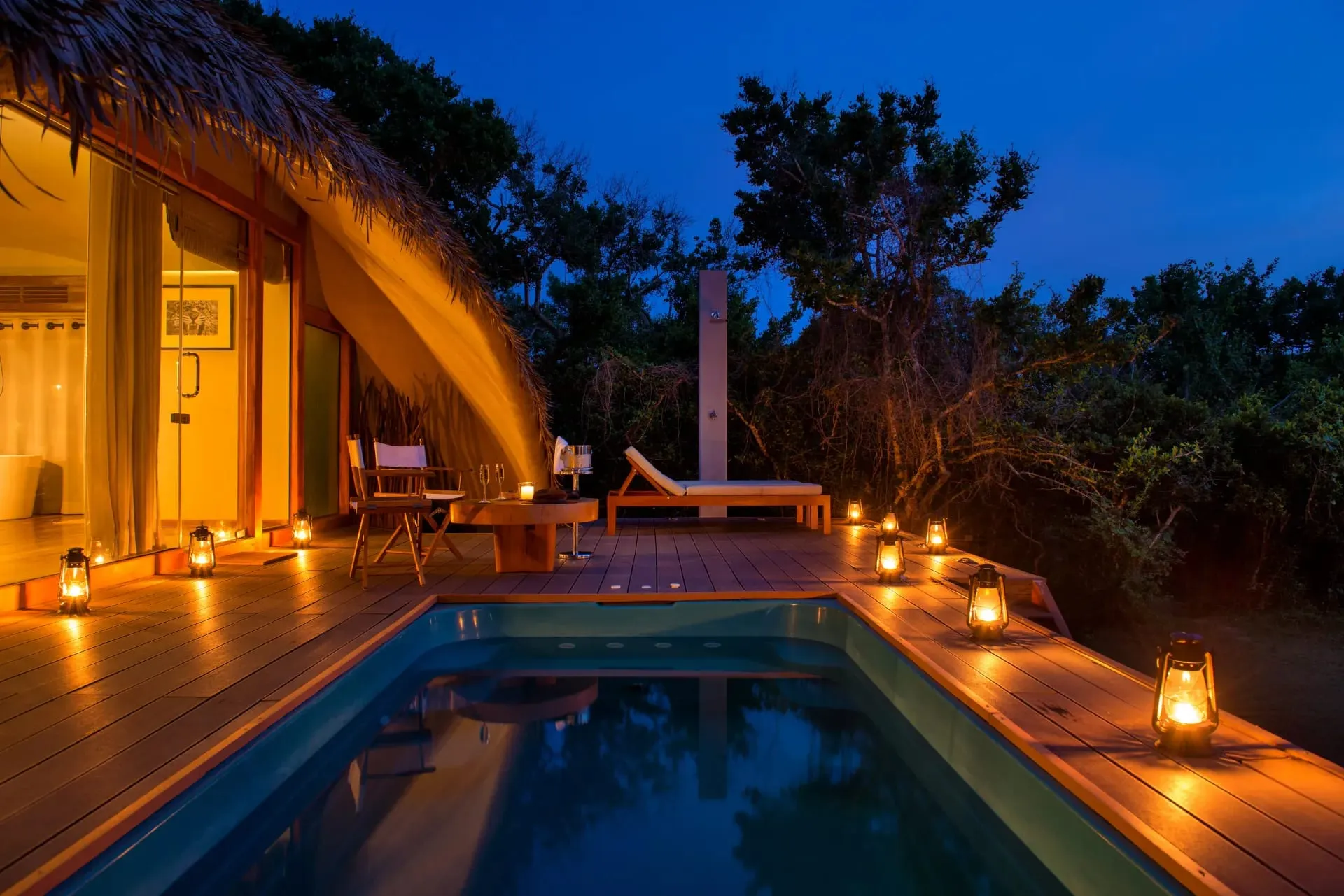 A thatched cabin at Uga Chena Huts with a private plunge pool set among dry-zone scrub at the edge of Yala National Park
